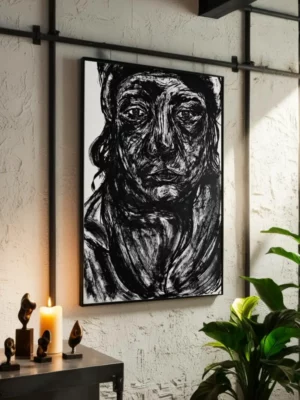 Big expressive black and white abstract drawing portrait of a sad woman face with ink strokes on paper